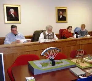 Members of Cold Spring Historic District Review Board with scale models on site exhibits in the foreground