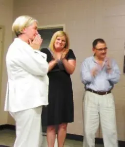 The retiring Maggie Davis (L) learns that the new playground has been named in her honor