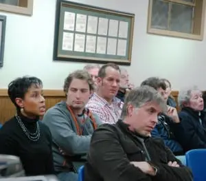 A wary audience listens as Janice Hogan (second from left) makes a point.