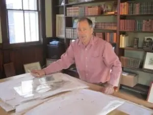 David Lilburne at work, sorting through prints