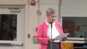 Judy Meyer reads the election results