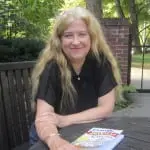 Author Jo Pitkin, pictured in the garden outside Butterfield Library. Photo by A. Rooney