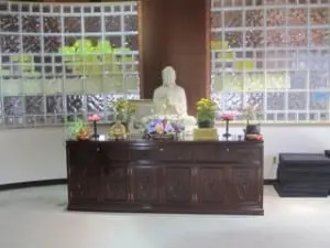 Meditation takes place on the floor near this shrine