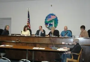 The Philipstown Town Board, from left--Dave Merandy, Nancy Montgomery, Richard Shea, Betty Budney, John Van Tassel, with Town Clerk Tina Merando, upper right