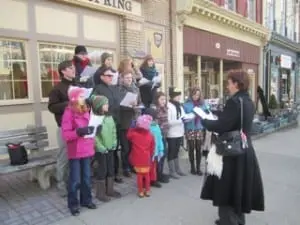 The carolers at their fourth and final stop, in front of the Village Hall