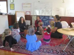Maria Stein Marrison, left, works with the children on forming sounds found only in the Spanish language. Photo by A. Rooney