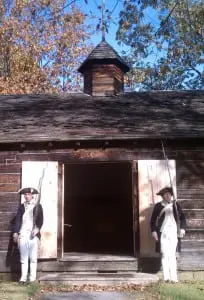 Costumed interpreters Sean Winchell and Matt Thorenz stand guard at the reconstructed Temple of Virtue at New Windsor Cantonment. Photo by M.A. Ebner