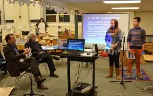 Haldane High School Principal Brian Alm, far left, and Superintendent Mark Villanti pose a question to Haldane seniors and Garrison School alumni Lindy Labriola and Simon Close at the Garrison School Board meeting Jan. 23. Photo by J. Tao