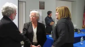 New York State Assemblywoman Sandy Galef, center, speaks with Superintendent Mark Villanti and School Board Vice President Gillian Thorpe.
