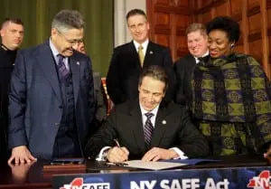 Governor Cuomo signs the NY SAFE Act on Jan. 15, 2013 (official photo).