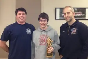 Left to right: Chief Matt Steltz, Firefighter Baisley and President Michael Bowman. Photo by Dawn Baisley