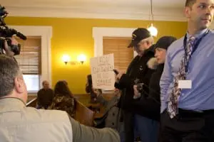 One of many citizens supporting Dennis Sant's decision; the sign reads: "Legal gun owners are not criminals." (Photo by K.E. Foley)