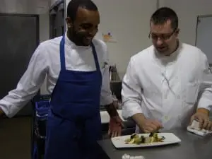 Sous chef Chris Limerick collaborates with Chef Brandon Collins in the Swift kitchen.