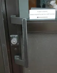 Message on the Community-Recreation Center door; photo by L.S. Armstrong