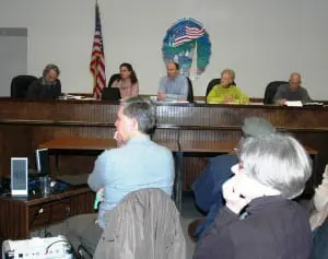 Supervisor Richard Shea, upper center, and other Town Board members listen and take notes as a resident comments during the dirt-roads workshop Jan. 16. Photo by L.S. Armstrong