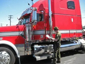 Vehicle emissions that exceed legal limits are a common form of air pollution. Here an ECO checks emission levels from a large diesel truck.