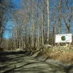 A sign on Old Albany Post Road, north of the area slated for work, displays anti-paving sentiments. Photo by L.S. Armstrong