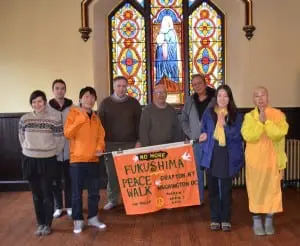 Walkers on the Peace Pilgrimage for a Nuclear-Free Future, led by Japanese Buddhist nun Yasuda Jun, far right, at St. Mary's Episcopal Church in Cold Spring (Photo by J. Tao)