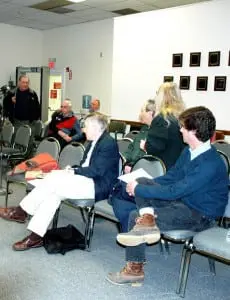 Roger Chirico, standing, upper left, answers questions from audience members at a Town Board discussion on dirt roads in March. Photo by L.S. Armstrong
