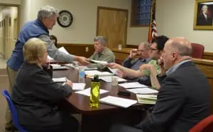Jeff MacDonald of Fuss and O'Neill passes out information about proposed upgrades to Cold Spring's wastewater treatment plant on April 16. Photo by J. Tao
