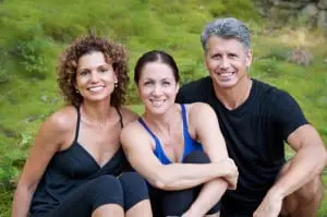 Living Yoga's owners Courtney Tarpley, left, Liz Schulman and Richard Villella