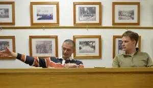 Nelsonville Mayor Tom Corless and Trustee Will Duncan speak with Trustee Ande Merante (not pictured) at their meeting April 8. Photo by J. Tao