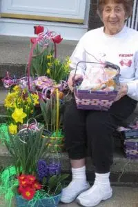 Highland Garden Club Treasurer Mary Joy of Cold Spring with Easter baskets (Photo courtesy of Highland Garden Club)