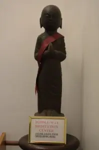 A statue greets visitors to the Peace Mountain Buddhist Hermitage.