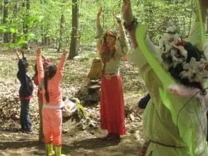 A woodland fairy tells the children to 'be a waterfall.'