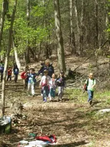The kindergartners head excitedly to their next activity.