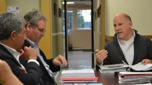 Paul Guillaro, left, Matt Moran and Matt Francisco on May 7 discuss the resolution for the Cold Spring Village Board to declare its intent to become lead agency on the Butterfield project.