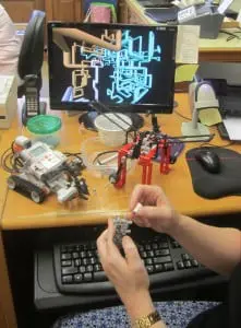 Preparing robots for use by the Project Code Spring contingent (Photo by A. Rooney)