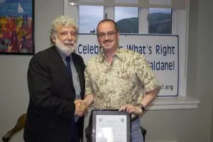 SuperintendentâMarkâVillantiâthanksâoutgoingâHaldaneâBoardâPresidentâMichaelâJunjulasâforâhisâthree-yearâtermâofâservice.âTheâboardâpresentedâJunjulasâwithâaâformalâcitation.