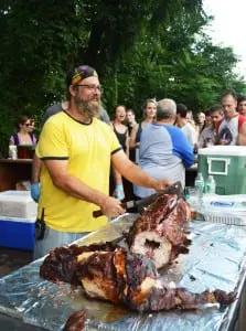 Studio .925's Chip Schwartz mans the pig roast.