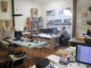 The interior of River Architects' busy office; Juhee Lee-Hartford at left. Photo by A. Rooney