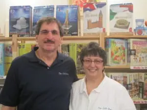 The Gift Hut's proprietors, Jim and Fran Farnorotto, in front of their many puzzles.