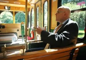 Riding the trolley, Vinny Tamagna discusses his plans for the revised route. 