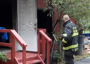 A member of the City of Beacon Fire Department surveys the damage from Saturday's blaze at Mid Hudson Animal Aid. Photo by MHAA Board President Don Petruncola