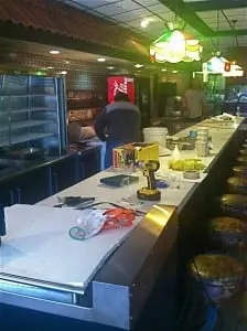 Repairs and cleanup behind the counter at Quinn's.