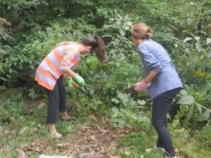 Annie Block, left, and Anita Csordas, get their hands dirty.