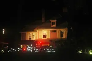 Firefighters work at Plumbush during a fire in 2010. File photo by L.S. Armstrong