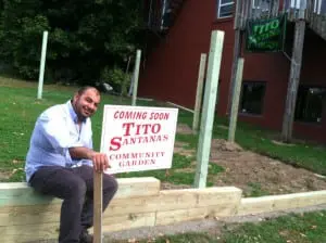 Kamel Jamal, owner of Beacon's Tito Santana and Cold Spring's Angelina's, in front of a new community garden at 142 Main St., in Beacon. (Photo by S. Hixson)