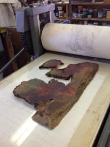 Matt Kinney planed and inked tree remnants such as this on the GAC press bed.