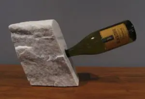 Bob Madden has rendered a series of marble wine caddies.