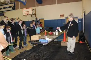 Mark Tatro, O'Neill High School chemistry teacher, lit various chemical compounds on fire to produce colorful flames.