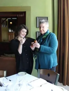 BrittanyâSpencer,âleft,âandâMarilynâHeberlingâaddâaâlittleâtheatricalâflavoringâtoâtheâmeal.ââ