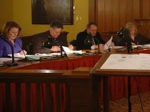 Legislators,âfromâleft,âBarbaraâScuccimarra,âSamâOliverio,âLouisâTartaro,âandâGinnyâNacerinoâstudyâmaterialsâandâawaitâcolleaguesâpriorâtoâtheâMarchâ4âPutnamâCountyâLegislatureâmeeting.â(PhotoâbyâL.S.âArmstrong)