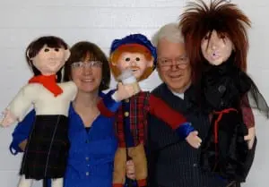 From left, Mary Schreiber and James Shearwood introduce puppets Cobbler Johnny, Tam O'Shanter and Witch One.