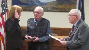 Cathryn Fadde is sworn in byâBobâBennett,âformerâCommissionerâwithâtheâPutnamâCountyâBoardâofâElections,âwhile her father, âHarryâFadde, holds the bible.