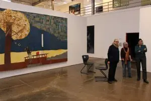 Collaborators, from left, Mara Mills, Donna Barkman and JoAnn Brody assess the theater/art connections. The work pictured is Jon Pylypchuk, "I Thought They Were My Children," mixed media on panel.
